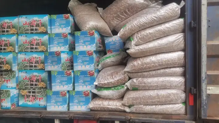 Truck loaded with boxed dried hawthorn products and bulk bags of dried ingredients for wholesale delivery